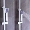 A close-up view of a modern shower system with a handheld showerhead spraying water. Náhled obrázku produktu