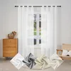 A room interior with a window covered by white sheer curtains, a wooden dresser, and a chair. Four swatches of fabric in different colors are displayed in the foreground. Produktbild-Vorschau