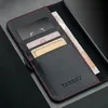 A close-up view of a black leather wallet with red stitching, holding credit cards and banknotes. Anteprima dell’immagine prodotto