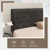 Close-up of a tufted headboard of a bed with a pillow and a sheet. Decorative icons and text are present at the bottom. Náhled obrázku produktu