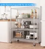 A four-tier wire shelving unit filled with kitchen appliances and food items, set against a tiled wall. Voir les images du produit