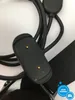 A close-up of a smartwatch charging cable and a portion of the smartwatch. Voir les images du produit