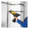 A person is using a cordless press tool to connect pipes. Produktbild-Vorschau