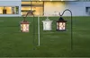 Three solar-powered lanterns on stakes in a grassy yard in front of a modern house. Anteprima dell’immagine prodotto
