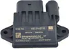 A black electronic control module with text and a logo printed on it. The module is mounted on two plastic brackets with screw holes. Podgląd zdjęcia produktu