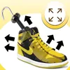 A shoe tree is inserted into a high-top sneaker, with arrows indicating expansion. Podgląd zdjęcia produktu
