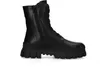 A black leather combat boot with a thick sole is shown against a white background. Produktbild-Vorschau