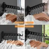 Collage of a wall-mounted folding clothes rack shown in different settings: bathroom, balcony, bedroom, and laundry room. Produktbild-Vorschau