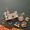 A LEGO castle set and loose LEGO bricks are arranged on a dark gray surface. Produktbild-Vorschau
