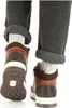 The back view of a pair of brown and white boots with gray socks and dark gray pants. Anteprima dell’immagine prodotto