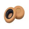 Two brown ear pads for headphones are shown on a white background. Produktbild-Vorschau