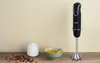 A hand blender is shown standing next to a bowl of soup and a small white pot on a wooden surface. Anteprima dell’immagine prodotto
