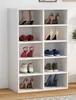 A white shoe rack filled with various pairs of shoes. Produktbild-Vorschau