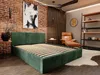 A bedroom scene with a green upholstered bed, a leather armchair, and shelves. Produktbild-Vorschau