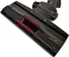 A close-up, angled shot of a vacuum cleaner floor head attachment against a white background. Produktbild-Vorschau