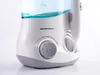 A close-up studio shot of a white and gray water flosser with blue water in the reservoir. Produktbild-Vorschau