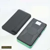 A black wallet-like case and a black and green power bank are displayed on a white background. Náhled obrázku produktu