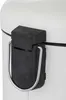 A close-up view of the pedal mechanism and handle of a white trash can. Produktbild-Vorschau
