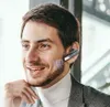 A man wearing a headset and a turtleneck is smiling. Produktbild-Vorschau