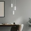 A modern office or dining space with a wooden desk, a leather chair, and a framed picture on the wall. Produktbild-Vorschau