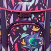 A close-up view of a purple backpack with a colorful floral pattern and a chameleon charm. Produktbild-Vorschau