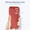 A hand holding a red phone case against a white background. Produktbild-Vorschau