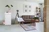 A living room scene with a sofa, chair, and side table. Náhled obrázku produktu