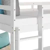 Close-up view of a white wooden bunk bed frame with a mattress and pillows. Náhľad obrázku produktu