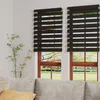 A living room scene with two windows covered by black and white zebra blinds, with a couch in the foreground. Voir les images du produit