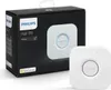 A Philips Hue Bridge and its packaging are displayed against a white background. Produktbild-Vorschau