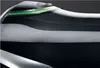 A close-up, layered view of a black and silver hair dryer with a green light strip. Produktbild-Vorschau