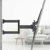 A black TV wall mount is attached to a wall, extending outwards with a TV attached to the end. Voir les images du produit
