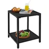 A black, two-tiered side table with a bowl of snacks and a glass of juice on the top shelf, and a basket of grapes on the bottom shelf. Produktbild-Vorschau