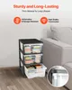 A 3-drawer storage cart filled with books, placed next to a sofa. Produktbild-Vorschau
