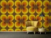 A living room scene with a retro-style wallpaper, a yellow armchair, and a small side table. Produktbild-Vorschau