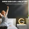 A woman waking up in bed next to a sunrise alarm clock. Produktbild-Vorschau