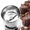 A coffee grinder with coffee beans and chocolates. Produktbild-Vorschau