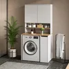 A modern laundry room setup with a washing machine, cabinets, and shelving. Produktbild-Vorschau