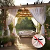 A decorated outdoor patio with sheer white curtains, a sofa, and plants, with a mosquito symbol overlay. Produktbild-Vorschau