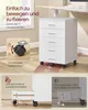 A white rolling cabinet with drawers is shown in a room, next to a window and a desk. The image highlights the mobility and stability features of the cabinet. Produktbild-Vorschau