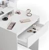 A close-up view of a white makeup vanity with various makeup products and accessories. Produktbild-Vorschau