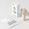 Product display with packaging and accessories on a plain background. Anteprima dell’immagine prodotto