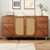 A wooden sideboard with rattan doors and gold legs, displayed in a room with artwork on the wall. Anteprima dell’immagine prodotto