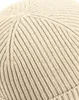 A close-up view of a knitted beanie. Anteprima dell’immagine prodotto