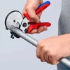 A person is using a pipe cutter to cut a metal pipe. Produktbild-Vorschau