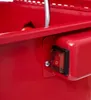 A close-up of a red workshop washing machine with a black and red switch. Produktbild-Vorschau