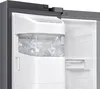 A close-up view of the interior of a refrigerator, showing an ice dispenser filled with ice cubes. Produktbild-Vorschau