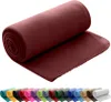 A rolled-up fleece blanket is shown against a white background, with a row of other colored blankets visible below. Náhľad obrázku produktu