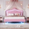 A pink upholstered bed with a crown-shaped headboard and LED lighting in a bedroom setting. Produktbild-Vorschau