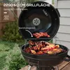 A charcoal grill with food cooking on it, set in an outdoor backyard setting. Produktbild-Vorschau